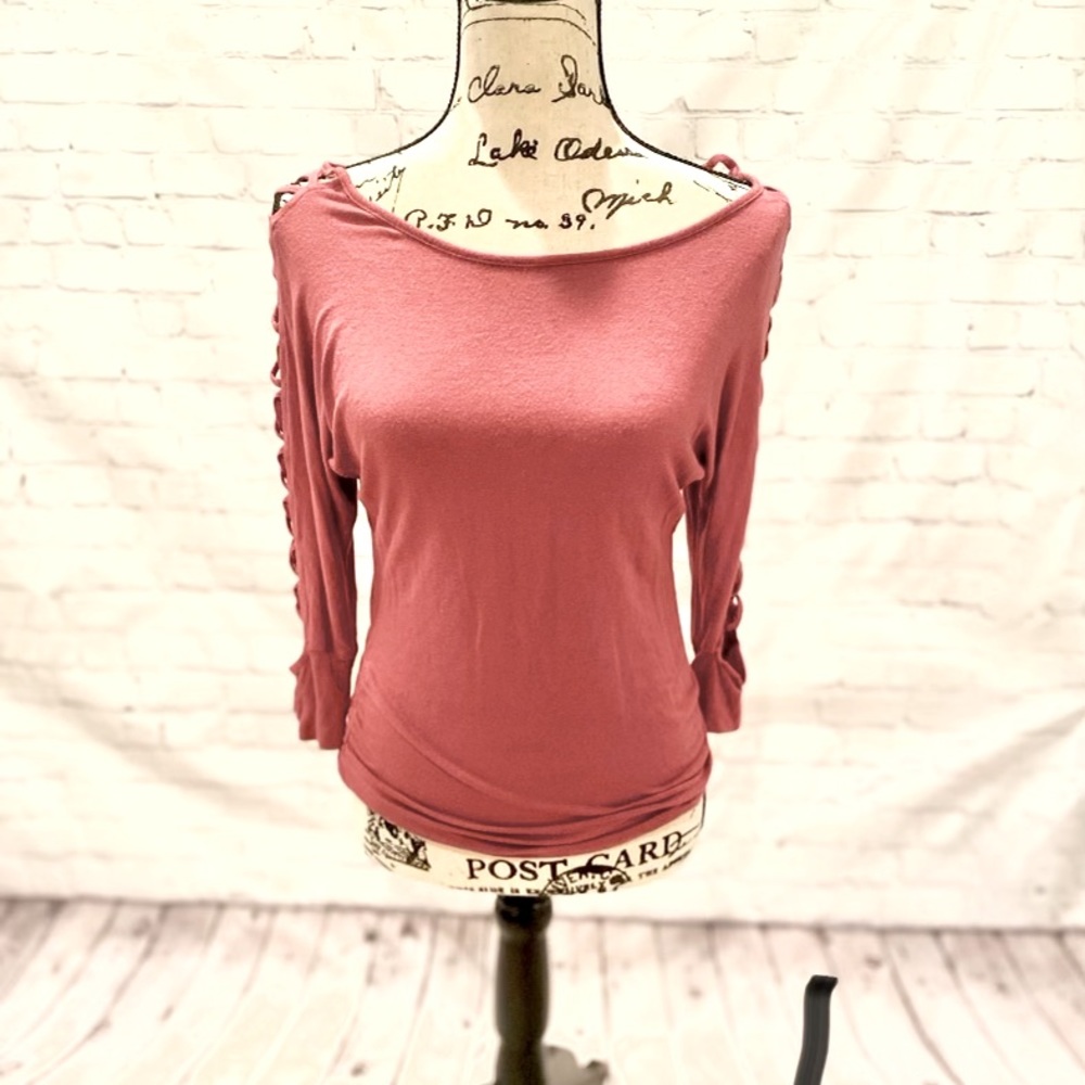 Fitted, soft, long sleeve. Open design down arm.